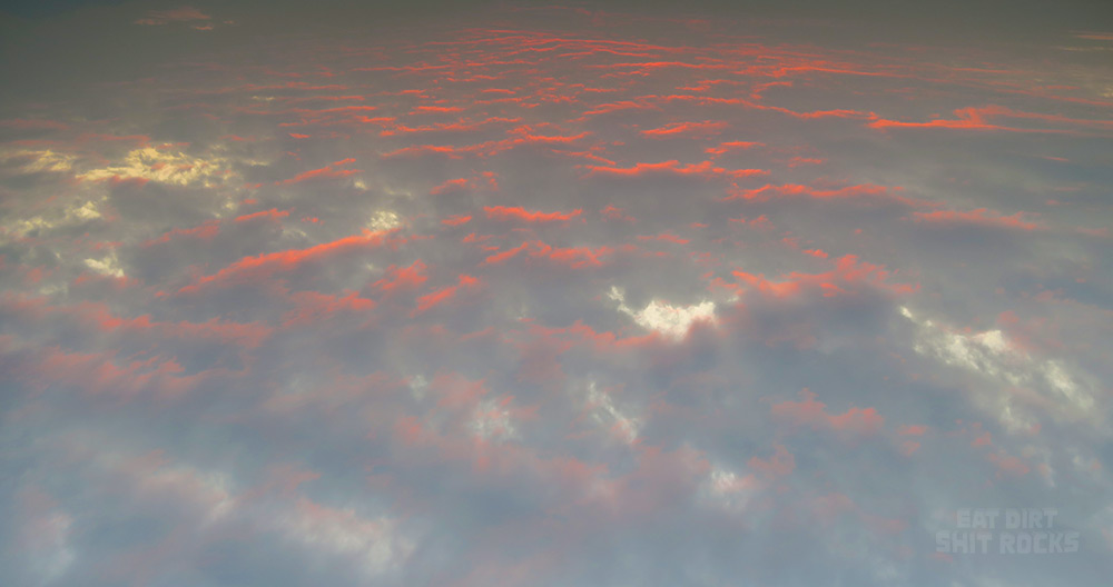 This picture of cloud bellies gone red-orange at sunset has been flipped upside down and, in my opinion, looks all the better for it.